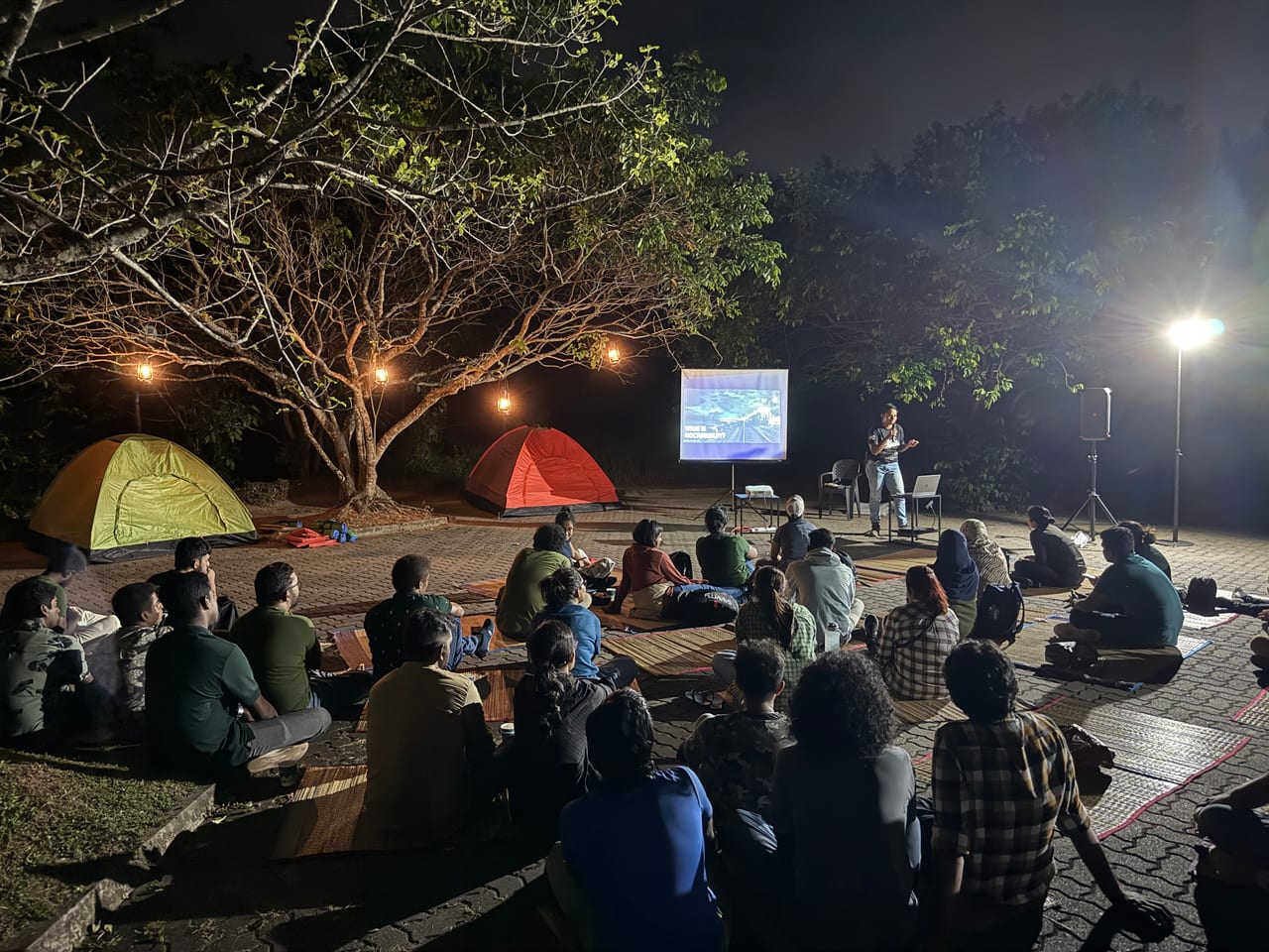 A public lecture audience at an evening event